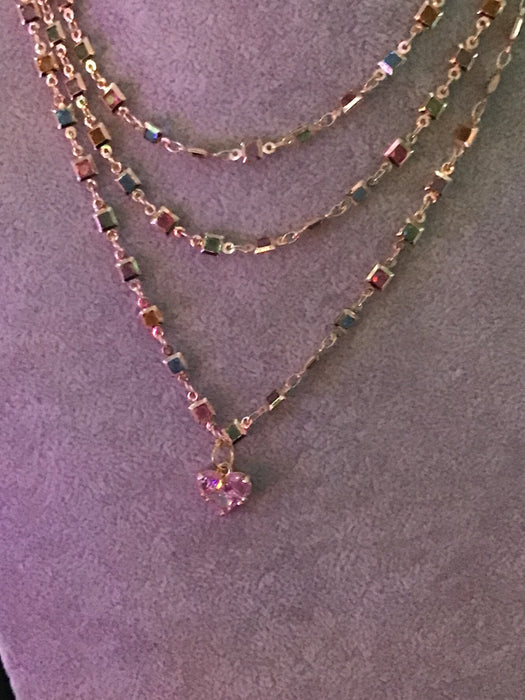 Multi-strand crystal; chain with crystal heart pendant.