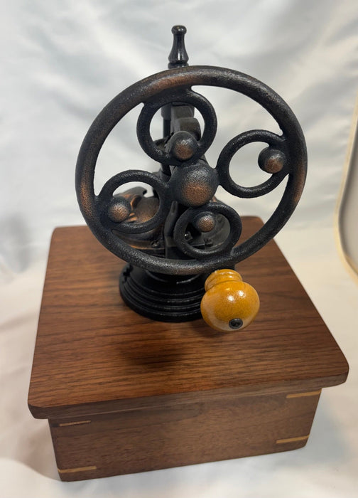 Walnut antique style coffee grinder.