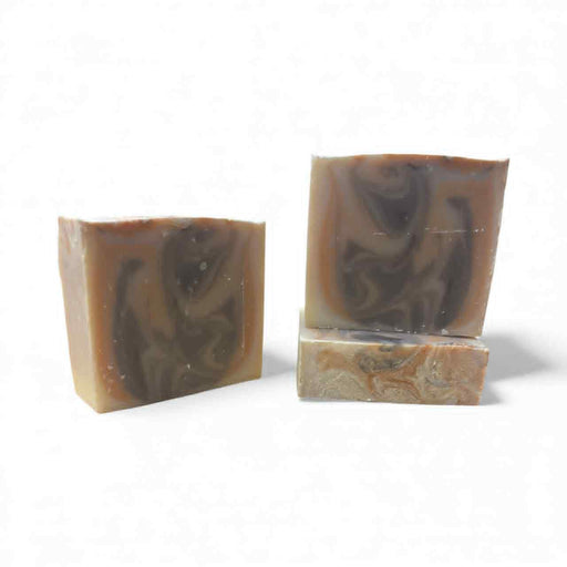 Three swirled soap bars on a white background