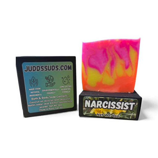 Colorful soap bar with 'Narcissist' text and Judds Suds branding on a white background