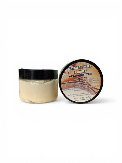 Jar of oatmeal milk and honey beard butter with a black lid on a white background