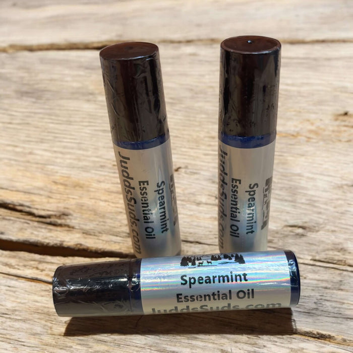 1.4oz glass roller bottle, filled with spearmint essential oil and olive oil. 