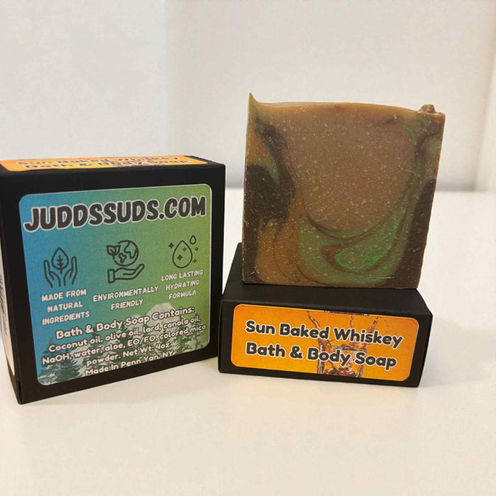 Bar of soap with packaging labeled 'Judds Suds' and 'Sun Baked Whiskey'.